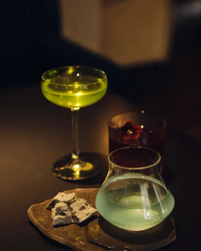 A moody tasting flight of three cocktails